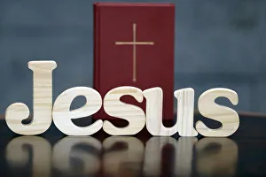 Studio Shot Prints: Wooden letters forming the word JESUS and Bible, Christian symbol, Vietnam, Indochina