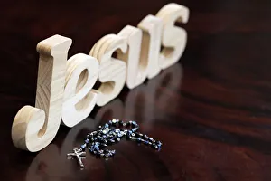 Rosary Prints: Wooden letters forming the word JESUS and Rosary, Christian symbol, Vietnam, Indochina
