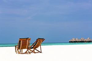 Absence Prints: Wooden sun loungers on beach, Coco Palm, Dhuni Kolhu, Baa Atoll, Republic of Maldives