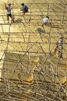 Gold Leaf Prints: Workers on bamboo scaffolding applying fresh gold leaf to the Shwedagon Pagoda