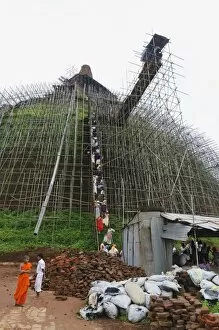 Images Dated 12th December 2011: Workers and scaffolding on the Abhayagiri Dagoba, Anuradhapura, UNESCO World Heritage Site
