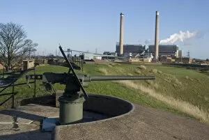 World War II gun with power station behind, at Tilbury Fort, used from the 16th to the 20th century