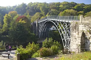 Worlds first iron bridge spans the banks of the River Severn in autumn sunshine, Ironbridge