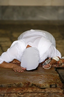 Images Dated 14th September 2007: Worshipper at the Stone of the Anointing, Church of the Holy Sepulchre