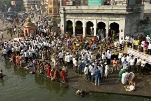 Unrecognisable People Prints: Worshippers at the Ramkund tank on the ghats along the holy River Godavari