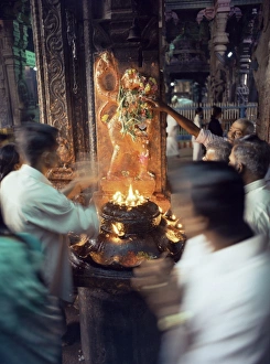 Worshippers at a shrine inside the Sri Meenakshi Temple