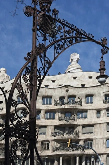 Lamp Prints: A wrought iron lamp frames La Pedrera (Casa Mila)