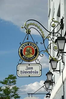 Bavaria Gallery: Wrought iron sign advertising Paulaner and Lowenbrau beer, Wolfrathausen