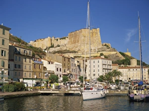 Yacht moored in harbour, with the citadel behind, Bonifacio, Corsica, France