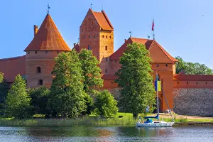 Lithuania Prints: Yacht in front of Trakai Island Castle, Trakai, Lithuania