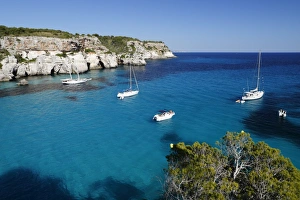 Yachts anchored in cove, Cala Macarella, near Cala Galdana, South West Coast, Menorca