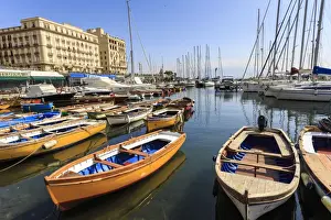 Vesuvius Prints: Yachts and colourful rowing boats in the marina Borgo Marinaro, Vesuvius in distance