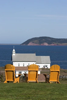 Images Dated 21st September 2009: Yellow Adirondack chairs overlooking church on an island in the Gulf of St