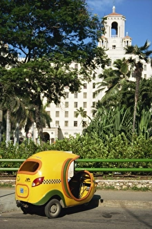 Tuk Tuk Prints: Yellow tuk tuk taxi and Hotel Nacional, Havana, Cuba, West Indies, Central America