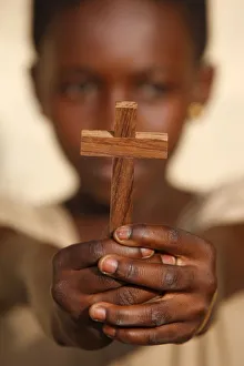 Girls Prints: Young African Christian holding a cross, Lome, Togo, West Africa, Africa