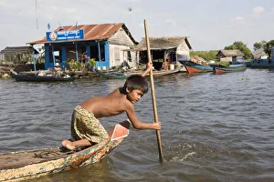 Cambodia Gallery: Young boy in a boat on Tonle Sap Lake, Cambodia, Indochina, Southeast Asia, Asia
