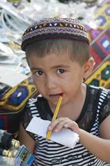 Images Dated 7th August 2009: Young boy with pen in his mouth, Khiva, Uzbekistan, Central Asia, Asia