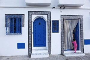 Old Port Prints: Young child and quayside house in the Old Port, Bizerte, Tunisia, North Africa, Africa