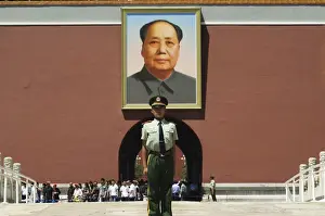 Mao Tse Tung Prints: Young guard in front of a portrait of Mao Zhe Dong on the Gate of Heavenly Peace built in the 15th century on the edge
