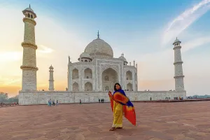 Taj Mahal Prints: Young Indian woman in front of the Taj Mahal