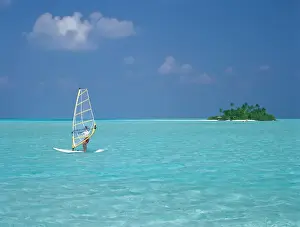 Balance Prints: Young man windsurfing near tropical island and lagoon in the Maldives, Indian Ocean