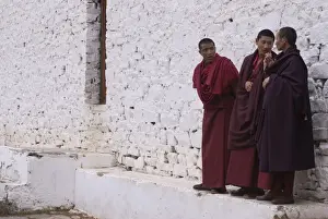 Three Men Prints: Young monks having a chat at the Paru Tsong a fortified monastery, Paru, Bhutan, Asia