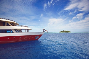 Dive Prints: Young people jumping from boat into sea, Maldives, Indian Ocean, Asia