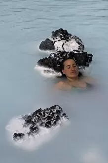 Images Dated 14th June 2009: Young woman enjoying bathing in hot spring, Blue Lagoon, Iceland, Polar Regions