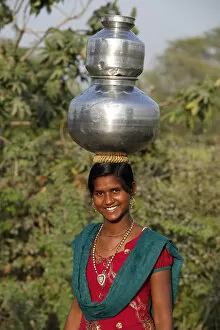 Traditionally Indian Gallery: Young woman fetching water, Mathura, Uttar Pradesh, India, Asia