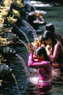 Young women at Tirta Empul temple