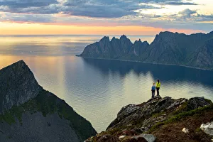 Friendship Prints: Two young women watching sunset standing on mountain top, Senja island, Troms county