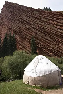 Rock Cliff Prints: Yurt below a dramatic rock formation, Jeti-Oghuz near Karakol, Kyrgystan, Central Asia
