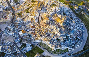 Ostuni Prints: Zenithal aerial view of the old town of Ostuni at sunset, Apulia, Italy, Europe
